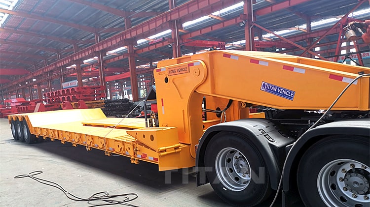 The detachable gooseneck trailer can use the lifting cylinder installed on the vehicle to support the front part of the semi trailer body on the ground. After the tractor is separated from the saddle of the semi trailer, the tractor is driven away from the semi trailer. When the tractor leaves, the front part of the semi trailer can be placed on the ground through the lifting cylinder, and the lifting cylinder can be continuously manipulated to convert the gooseneck platform into a semi trailer ladder, thereby solving the problem of the large rear part of the detachable gooseneck trailer.  3 Axle Detachable Gooseneck Trailer for Sale in Nigeria